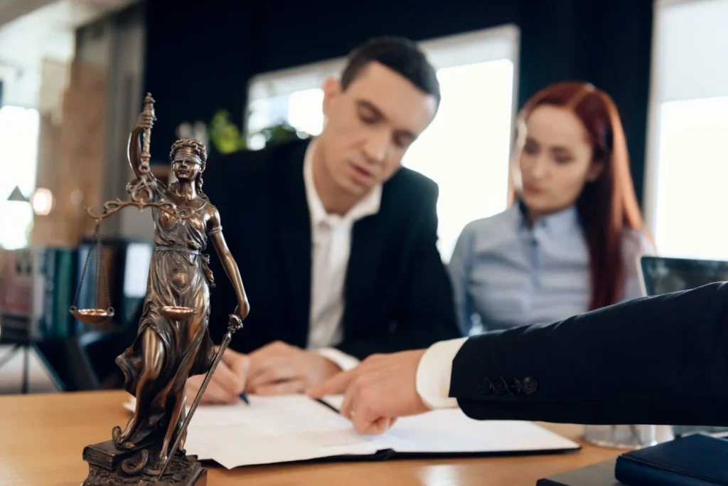 Divorce Lawyer explaining legal document to a client during a consultation
